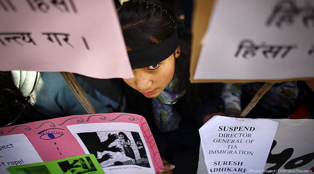 A Nepalese woman takes part in a protest demanding stronger laws that protect women against physical and sexual abuse