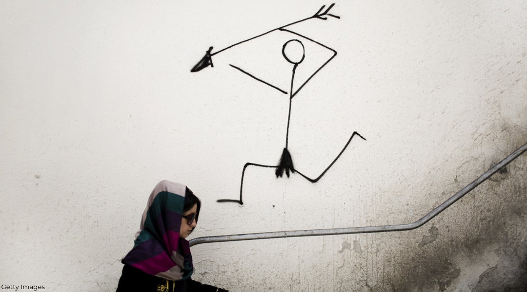 Iranian woman walking through Tehran