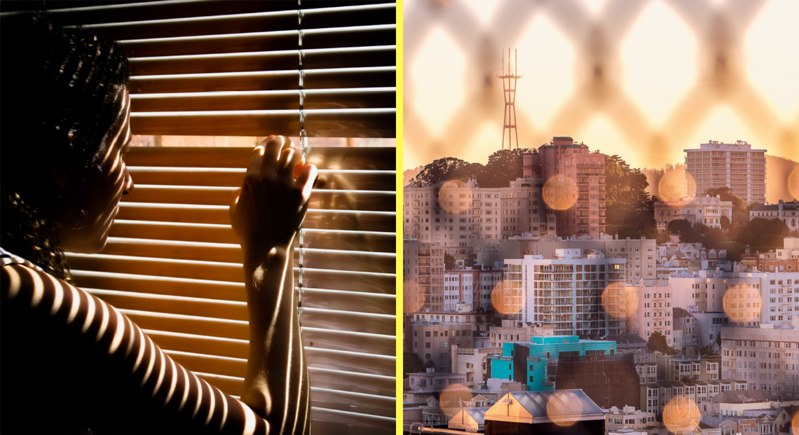 Immigrant peering through window blinds. View of San Francisco behind fence.