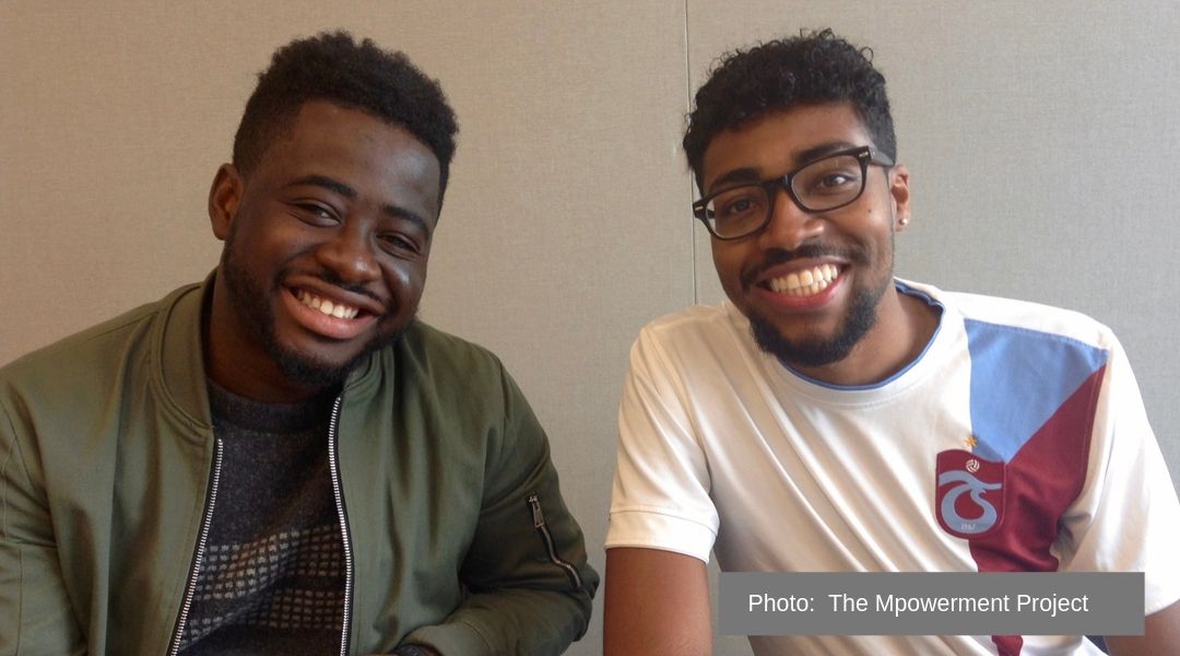 Two young black men attending a Mpowerement Project training