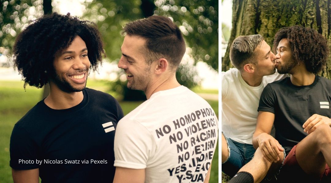 A mixed race gay couple having a date in a local park