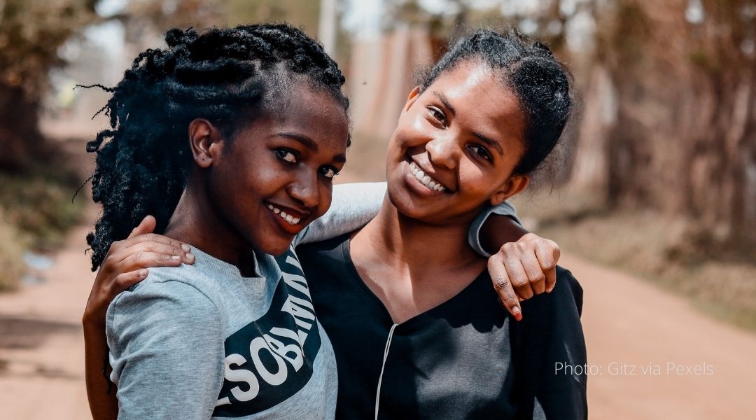 Two Kenyan women embrace