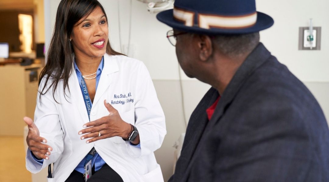 A UCSF doctor meets with a patient