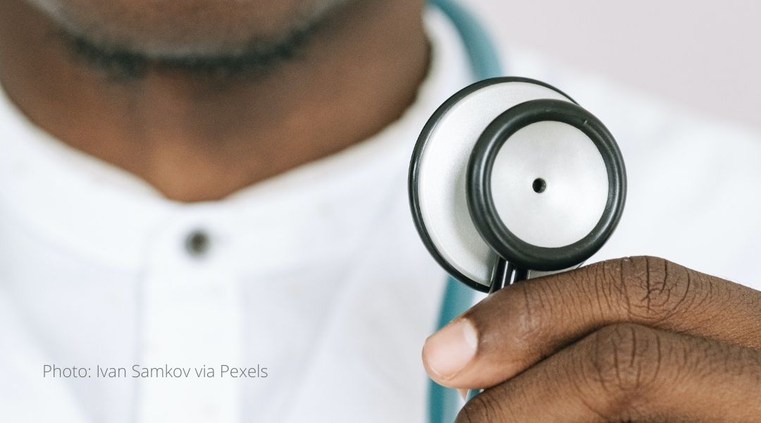 A doctor holds a stethoscope